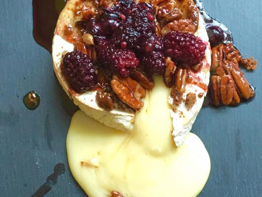 Baked camembert topped with berries & walnuts